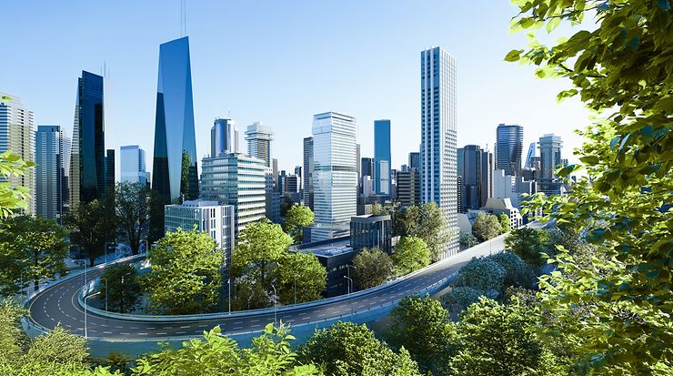 Moderne Stadt mit wolkenkratzenden Gebäuden, umgeben von Bäumen und grünen Landschaften.